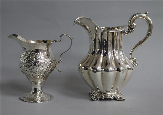 A George III silver inverted pear shaped cream jug, London, 1773 and a Victorian silver cream jug.